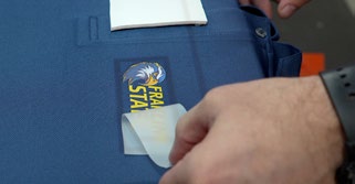 Multicolor Logo applied to navy Pants using Direct-To-Garment (DTG)