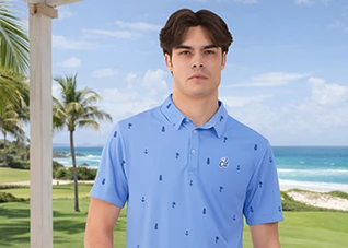 A man in a patterned blue polo shirt standing on the beach