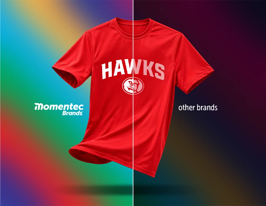 A shirt with a custom logo on it is centered in an image which is split down the middle with one half having a clear and vibrantly visible logo with Momentec Brands logo on that side and the other half having a faded and blurry logo with text that says 'Other Brands' on that side.